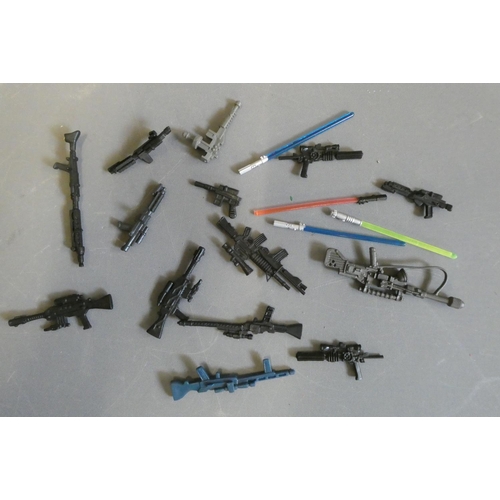 312 - Seventeen Star Wars assorted weapons including guns and light sabres