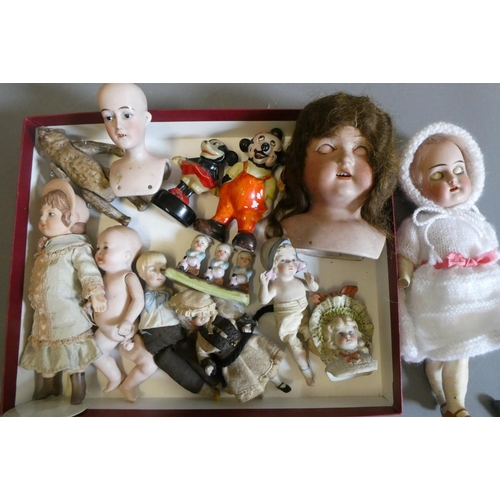 65 - A collection of vintage and antique dolls and toys, including all bisque examples, an all bisque bea... 