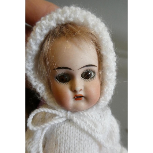 65 - A collection of vintage and antique dolls and toys, including all bisque examples, an all bisque bea... 
