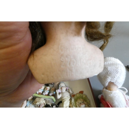 65 - A collection of vintage and antique dolls and toys, including all bisque examples, an all bisque bea... 