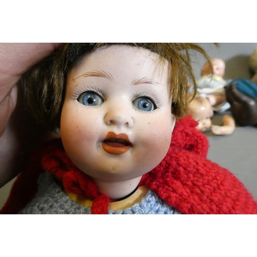 66 - Eight vintage and early 20th century dolls, including an AM 351 baby, a Heubach Koppelsdorf 300, thr... 