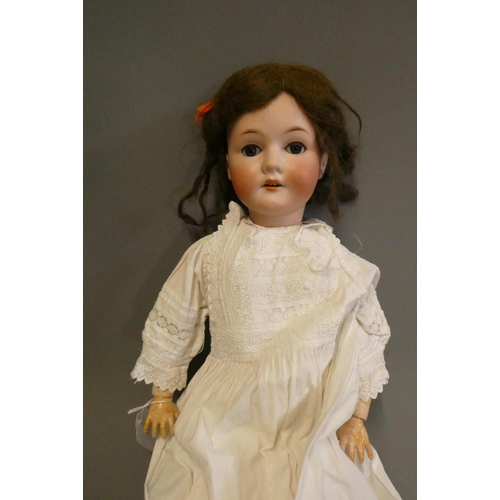 67 - A Bergmann Walterhausen bisque socket head doll, with blue glass sleeping eyes, open mouth, teeth, w... 