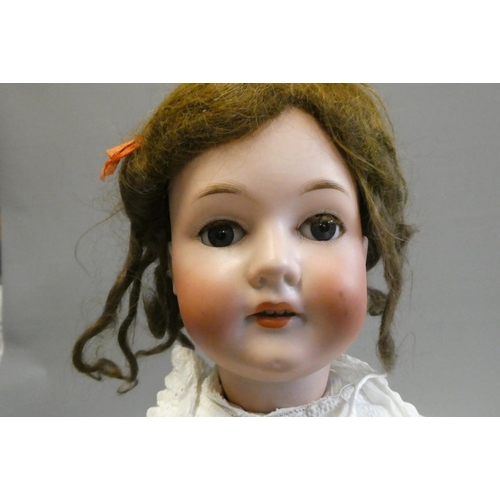 67 - A Bergmann Walterhausen bisque socket head doll, with blue glass sleeping eyes, open mouth, teeth, w... 