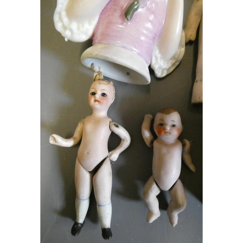 68 - Seven vintage dolls, comprising three all bisque doll's house dolls, including one with glass eyes, ... 