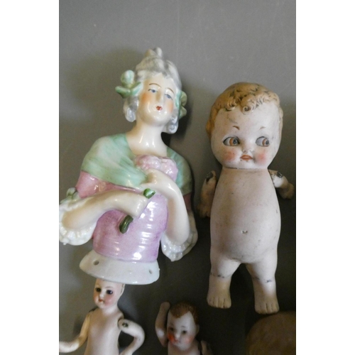 68 - Seven vintage dolls, comprising three all bisque doll's house dolls, including one with glass eyes, ... 