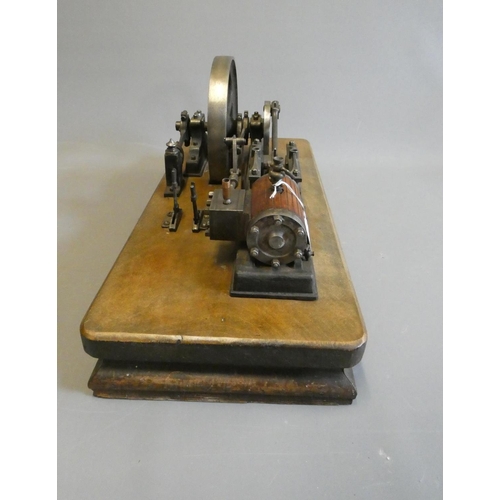 694 - A large horizontal stationary single cylinder mill engine, wood lagged cylinder with drain cocks dri... 