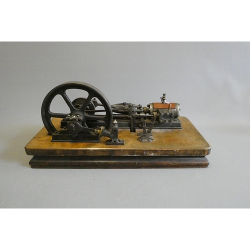 694 - A large horizontal stationary single cylinder mill engine, wood lagged cylinder with drain cocks dri... 