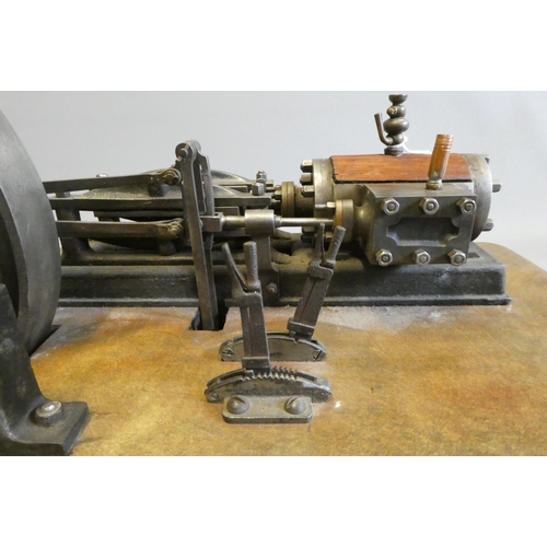 694 - A large horizontal stationary single cylinder mill engine, wood lagged cylinder with drain cocks dri... 