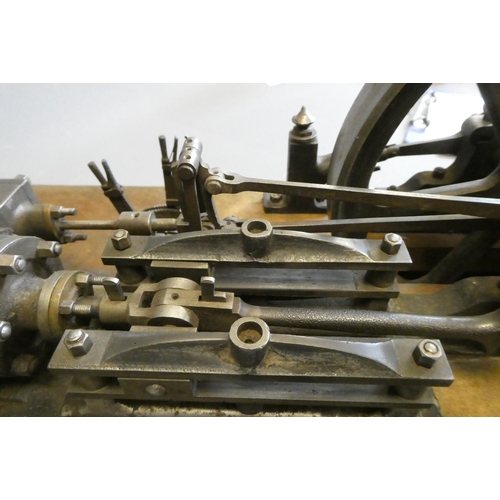 694 - A large horizontal stationary single cylinder mill engine, wood lagged cylinder with drain cocks dri... 