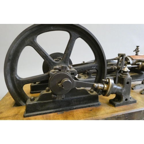 694 - A large horizontal stationary single cylinder mill engine, wood lagged cylinder with drain cocks dri... 