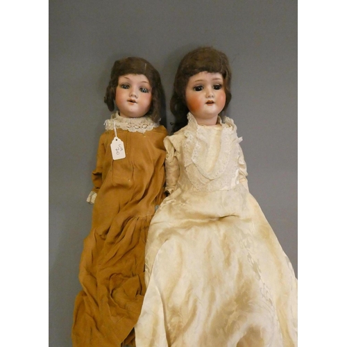 70 - Two German bisque socket head dolls, comprising a 21