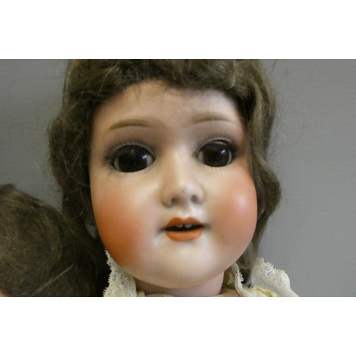 70 - Two German bisque socket head dolls, comprising a 21