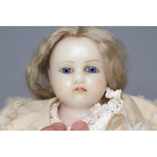 74 - A Victorian poured wax shoulder head doll, with blue glass fixed eyes, closed mouth, blond wig, fabr... 