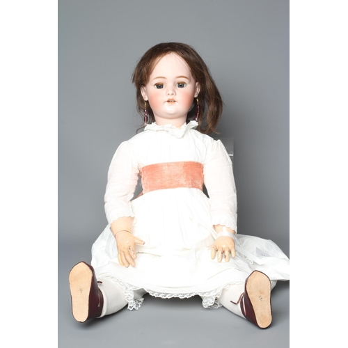 75 - A Simon & Halbig bisque socket head doll, with blue glass sleeping eyes, open mouth, teeth, pierced ... 