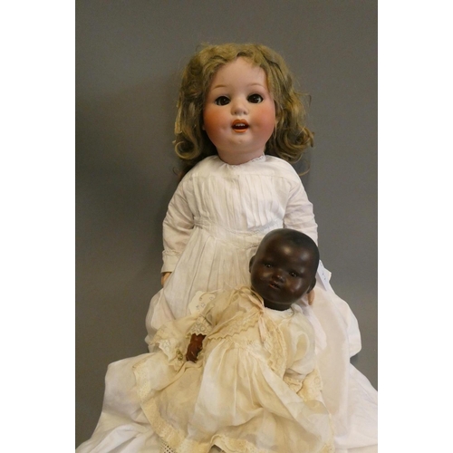 77 - A Heubach Koppelsdorf bisque socket head character doll, with brown glass sleeping eyes, open mouth,... 