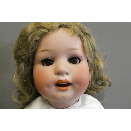 77 - A Heubach Koppelsdorf bisque socket head character doll, with brown glass sleeping eyes, open mouth,... 