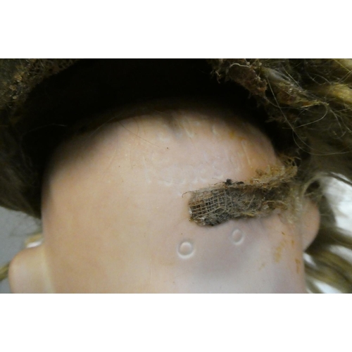 77 - A Heubach Koppelsdorf bisque socket head character doll, with brown glass sleeping eyes, open mouth,... 