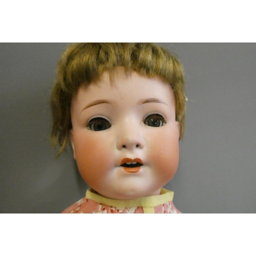 79 - A Heubach Koppelsdorf bisque socket head doll, with blue glass sleeping eyes, open mouth, teeth and ... 
