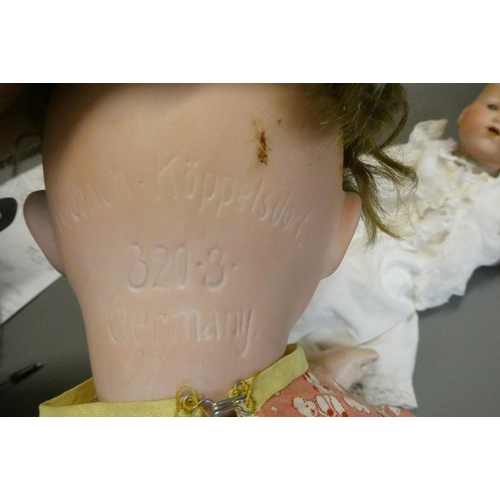 79 - A Heubach Koppelsdorf bisque socket head doll, with blue glass sleeping eyes, open mouth, teeth and ... 