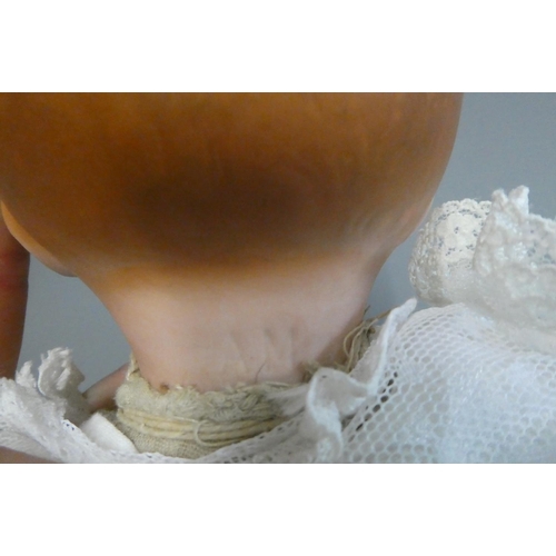 79 - A Heubach Koppelsdorf bisque socket head doll, with blue glass sleeping eyes, open mouth, teeth and ... 