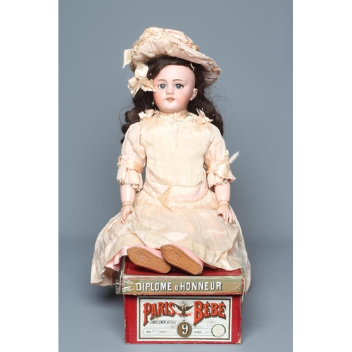 80 - A French boxed Paris Bebe bisque socket head doll, with blue glass sleeping eyes, open mouth, teeth,... 