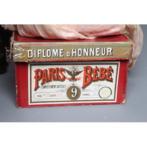 80 - A French boxed Paris Bebe bisque socket head doll, with blue glass sleeping eyes, open mouth, teeth,... 