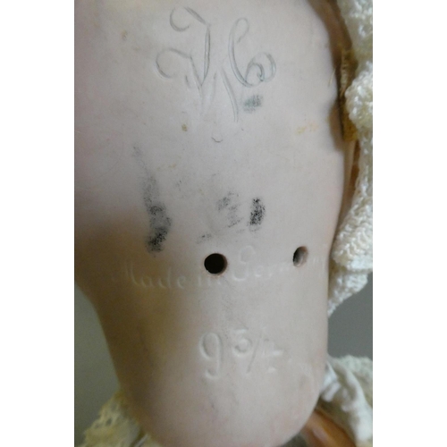 82 - A German bisque socket head character doll, with blue glass sleeping eyes, open mouth, applied top t... 