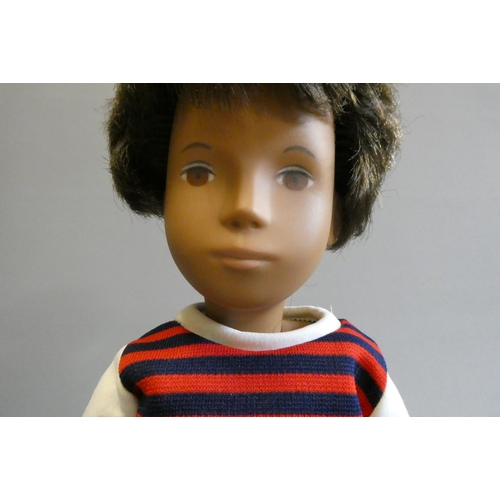 84 - A Sasha boy doll, with brown hair, jointed body and striped top, 16