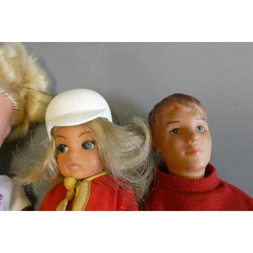 85 - Vintage dolls comprising three Sindy dolls (one with scooter), a Pedigree Sindy Paul doll, and a Bar... 