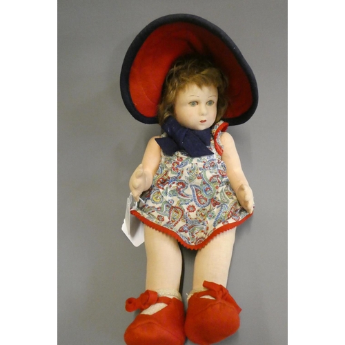87 - A Lenci girl doll, with fabric construction, painted features, original dress, felt shoes and hat, 1... 