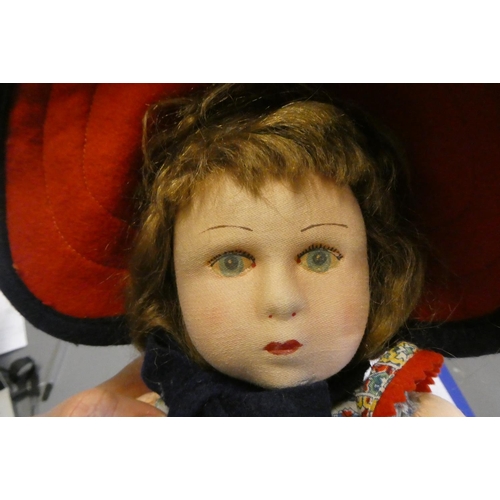 87 - A Lenci girl doll, with fabric construction, painted features, original dress, felt shoes and hat, 1... 