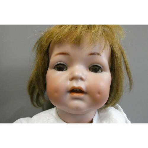 88 - A Simon & Halbig K & R bisque socket head doll, with brown glass sleeping eyes, open mouth, applied ... 