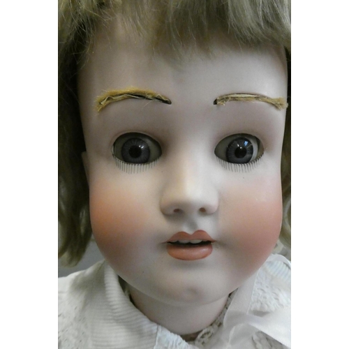 89 - A Heinrich Handwerck Simon & Halbig bisque socket head doll, with blue glass eyes, open mouth, teeth... 