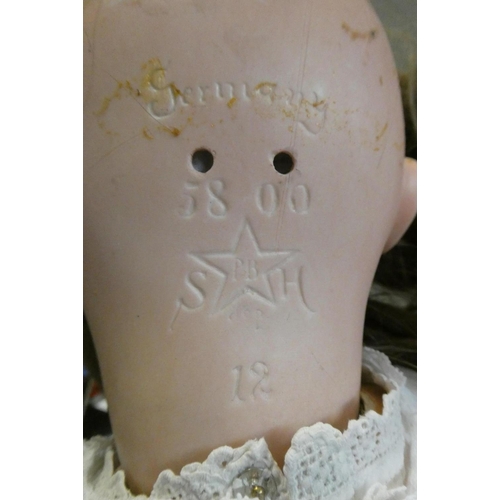 90 - A Schoenau & Hoffmeister bisque socket head doll, with blue glass sleeping eyes, open mouth, teeth, ... 