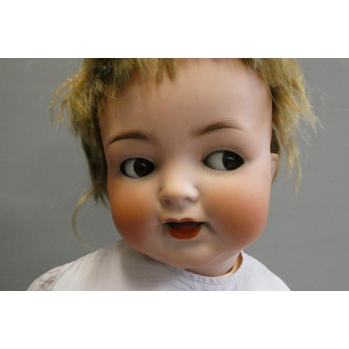 91 - A Heubach Koppelsdorf bisque socket head flirty doll, with brown glass side-ways glancing eyes, meta... 