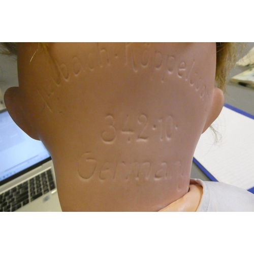 91 - A Heubach Koppelsdorf bisque socket head flirty doll, with brown glass side-ways glancing eyes, meta... 