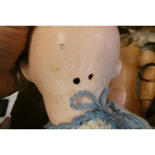 92 - Two Armand Marseille bisque socket head dolls, comprising a large 390 15 with blue glass sleeping ey... 