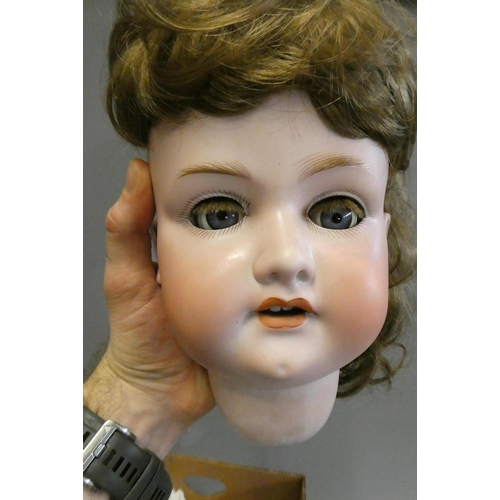 92 - Two Armand Marseille bisque socket head dolls, comprising a large 390 15 with blue glass sleeping ey... 