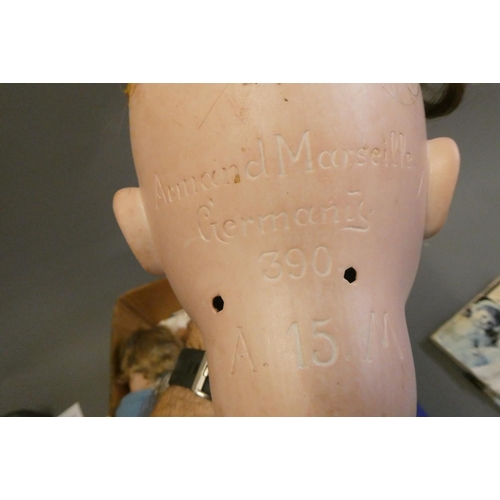 92 - Two Armand Marseille bisque socket head dolls, comprising a large 390 15 with blue glass sleeping ey... 
