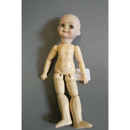 94 - An Armand Marseille type bisque socket head character doll, with large sideways glancing glass eyes,... 