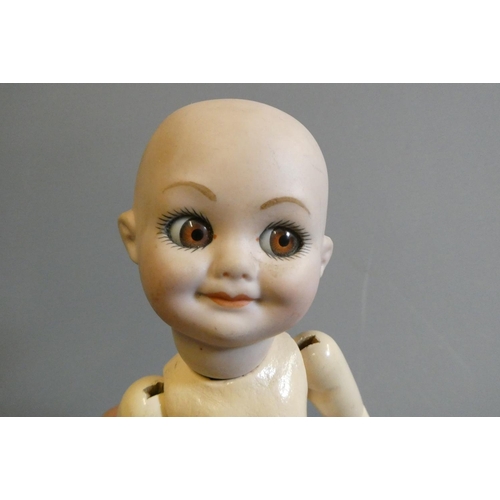 94 - An Armand Marseille type bisque socket head character doll, with large sideways glancing glass eyes,... 