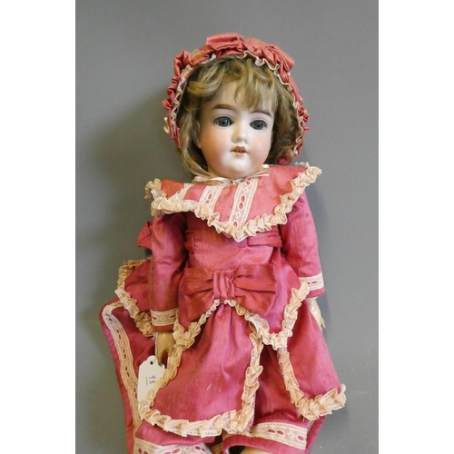 98 - A Cuno & Otto Dressel bisque socket head doll, with blue glass sleeping eyes, open mouth, teeth, unm... 