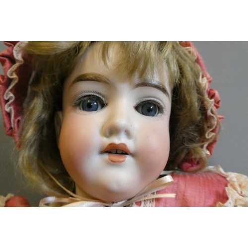 98 - A Cuno & Otto Dressel bisque socket head doll, with blue glass sleeping eyes, open mouth, teeth, unm... 