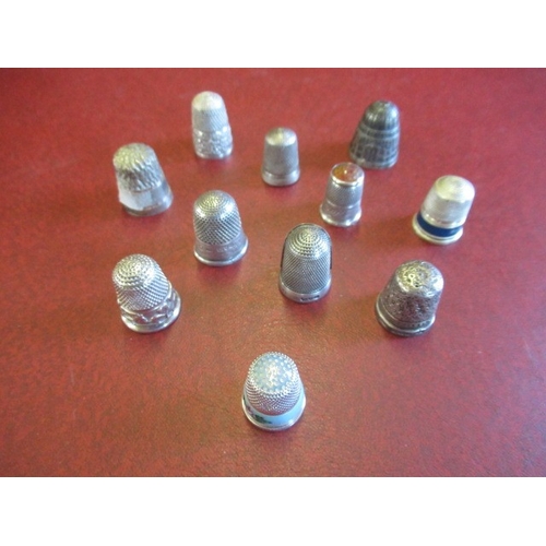 287 - SILVER FINGERNAIL THIMBLE AND TEN OTHER SILVER THIMBLES