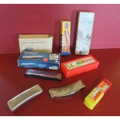 29 - BOX OF HARMONICAS