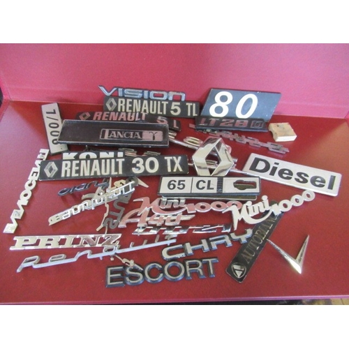 38 - BAG OF CAR BADGES
