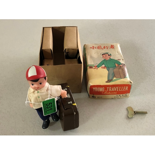 531 - young traveller tin plate clockwork toy in original box and in very good condition