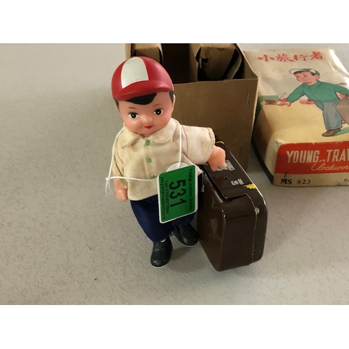 531 - young traveller tin plate clockwork toy in original box and in very good condition