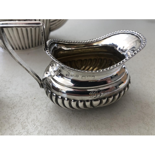 87 - 1899 sterling silver tea set comprising tea pot, sugar bowl and milk jug engraved