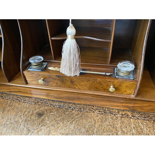 115 - figured walnut cylinder desk on carved gabriole legs with a fitted interior, inkwells with original ... 